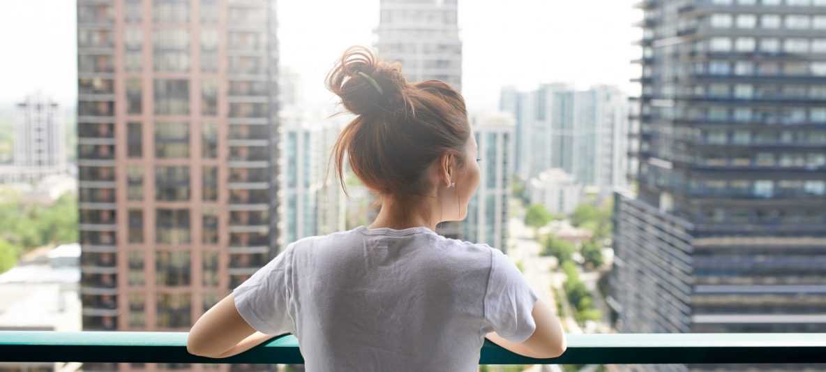 Woman standing on balcony